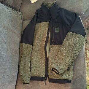 Like new. My son wore once. Great warm coat for back and forth to school. I